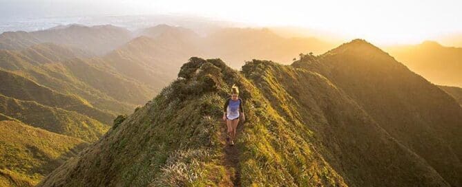 girl high up on mountain trail