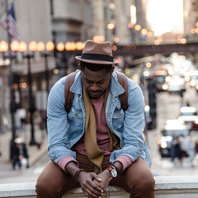 depressed man in the middle of the city