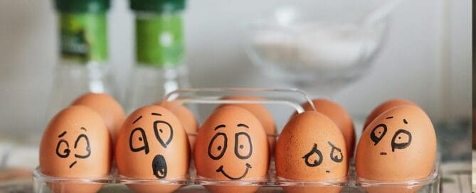 hard boiled eggs with faces drawn on them