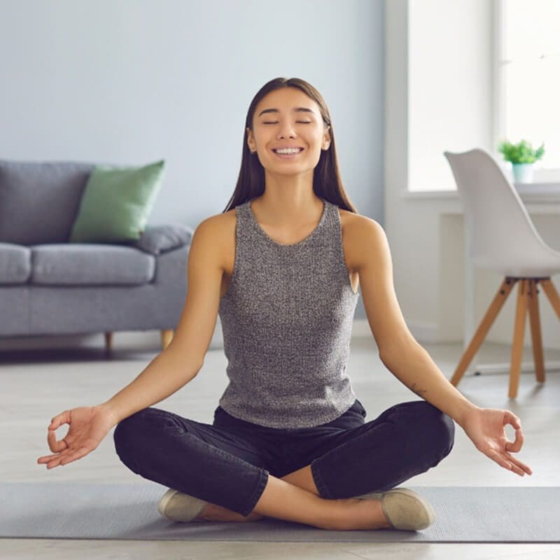 woman doing yoga in home