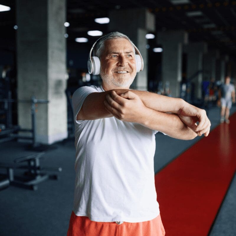 A man exercising while listening to music A man exercising while listening to music