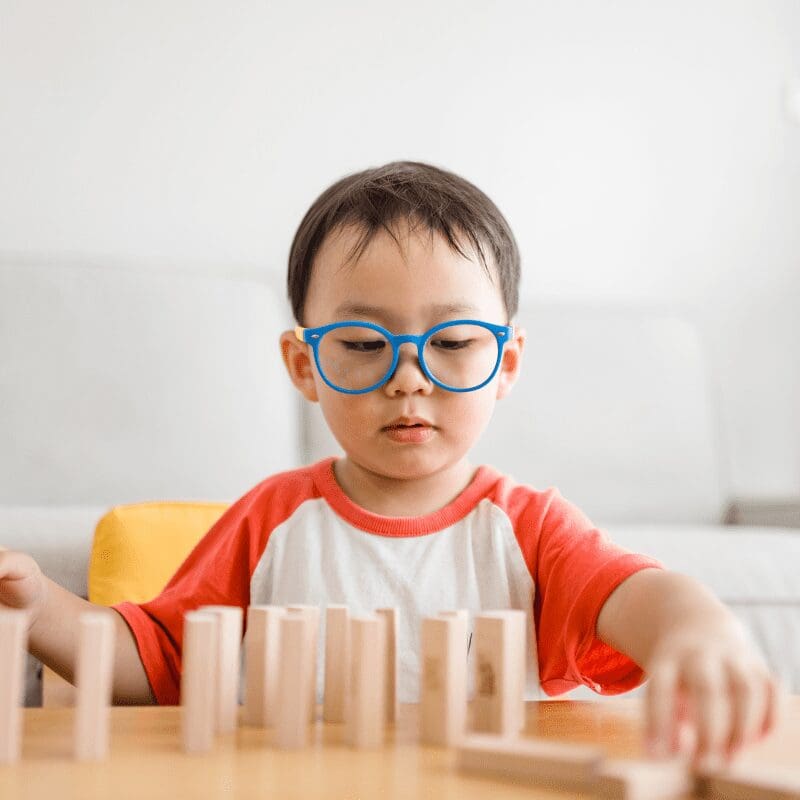 A boy playing with blocks A boy playing with blocks