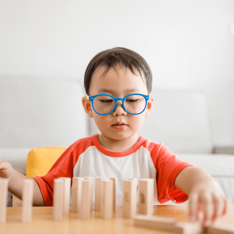 A boy playing with blocks