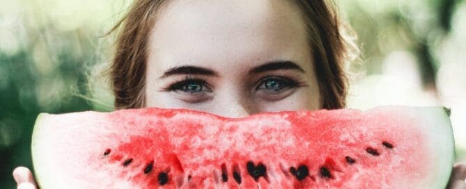 Teenager with a big slice of watermelon