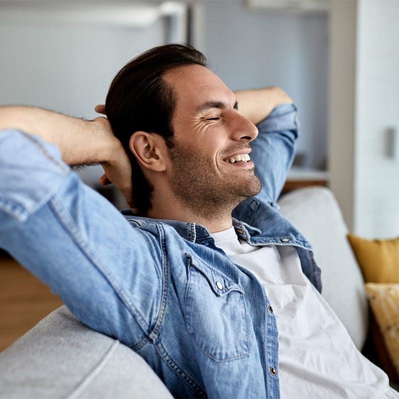 young man relaxing on sofa