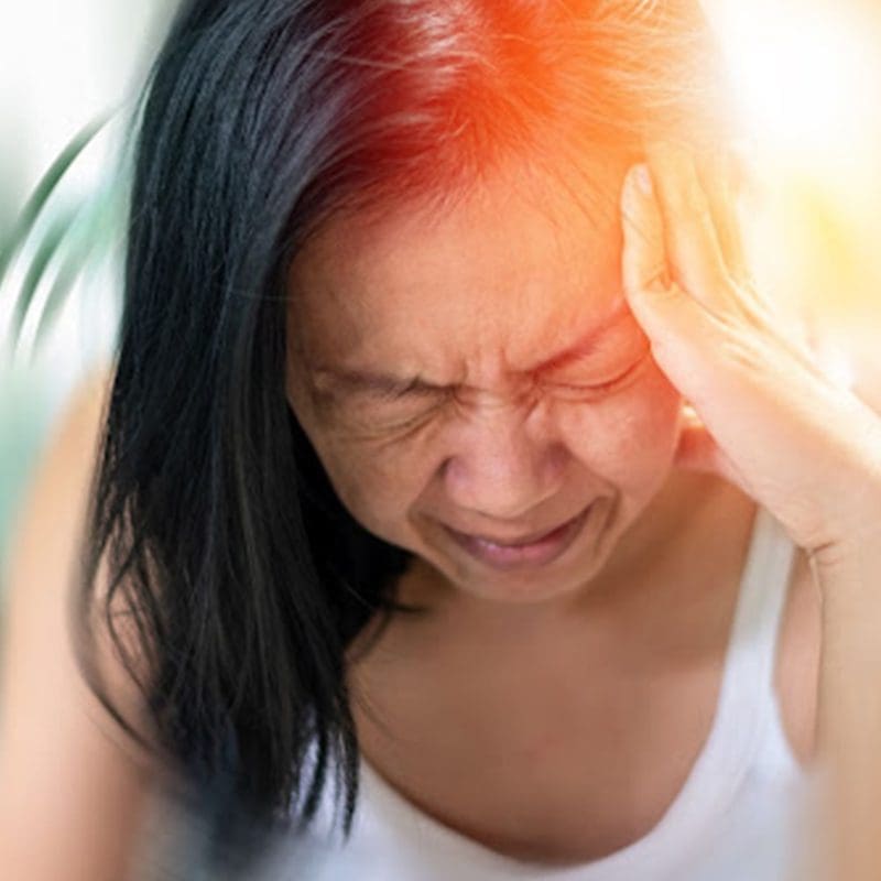 woman suffering from migraines