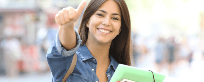 student girl giving thumbs up