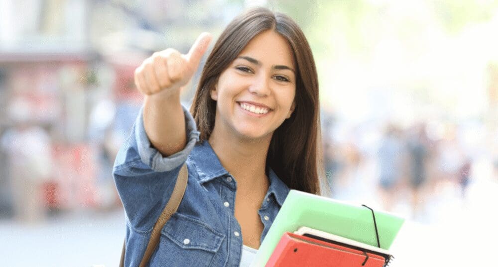 student girl giving thumbs up