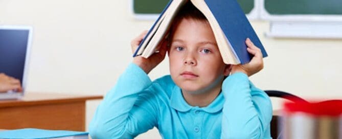 child with book overhead