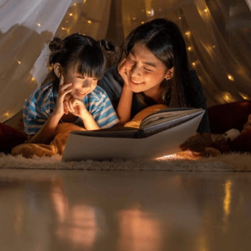 parent and child reading a book