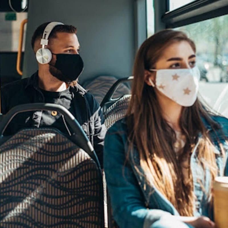 people wearing a mask on public transit