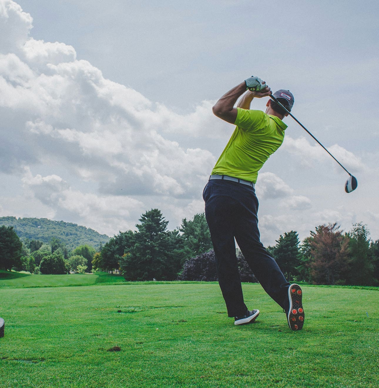 golfer swinging long shot