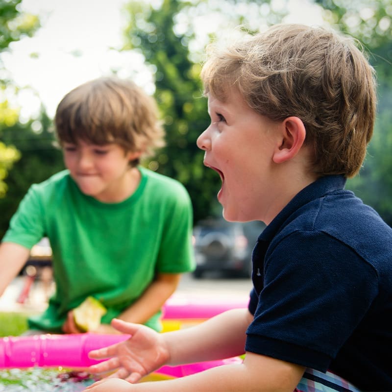 2 kids playing outside