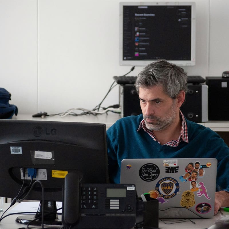 man focused working on laptop