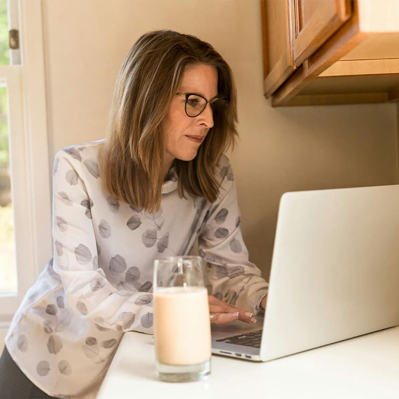 woman using computer at home