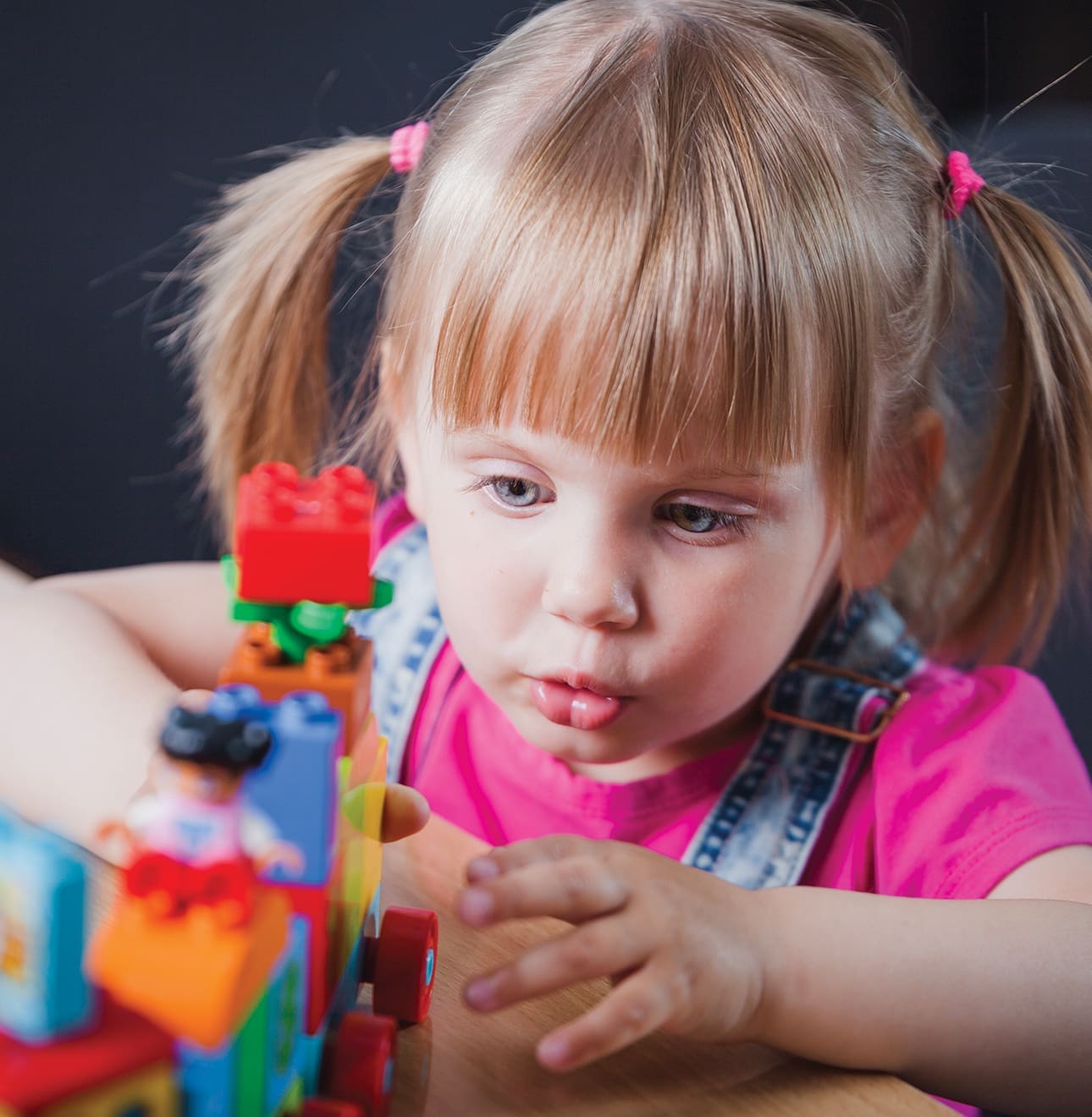 child building tower from legos