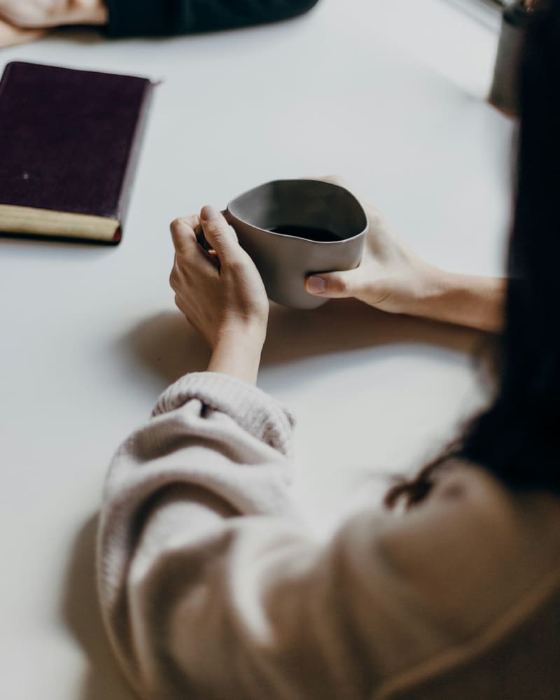 Woman holding coffee cup