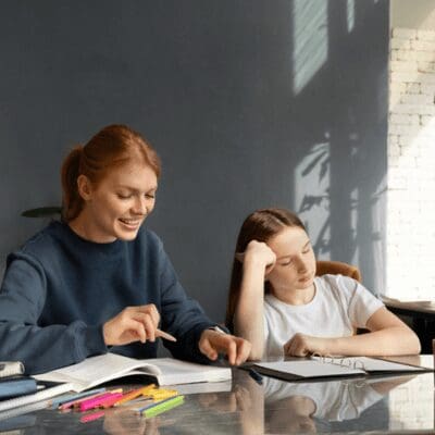 _happy teacher trying to teach tired girl happy teacher trying to teach tired girl