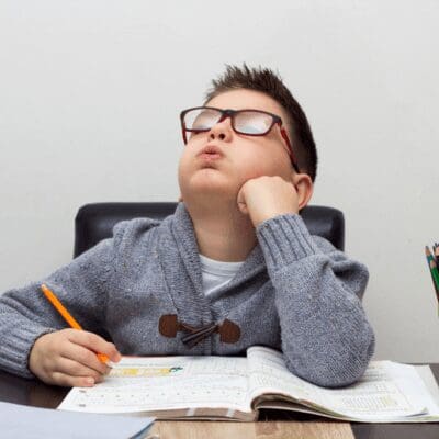 young-boy-frustrated while doing homework young-boy-frustrated while doing homework