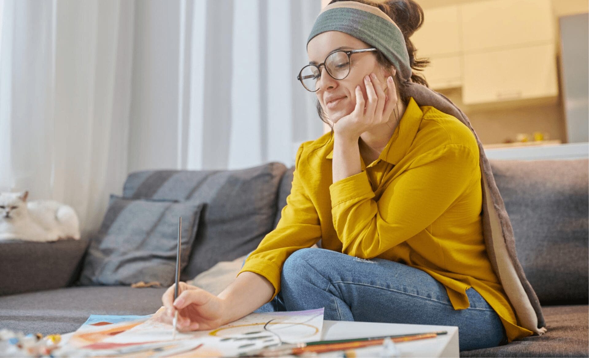 woman with adhd symptoms painting to regulate her brain